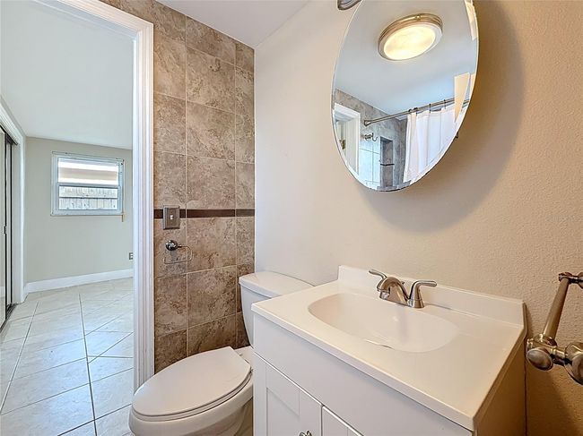 Full Bath and view into Primary Bedroom | Image 15