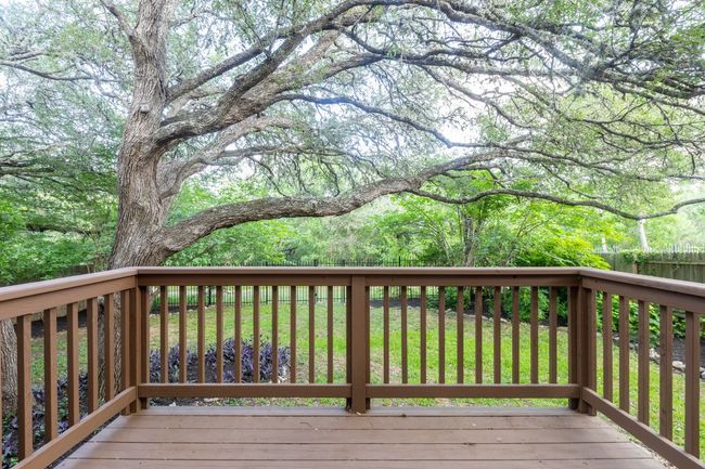 Nice deck looking over the private back yard. There's a trail behind the fence that leads to Kiker Elementary! | Image 31