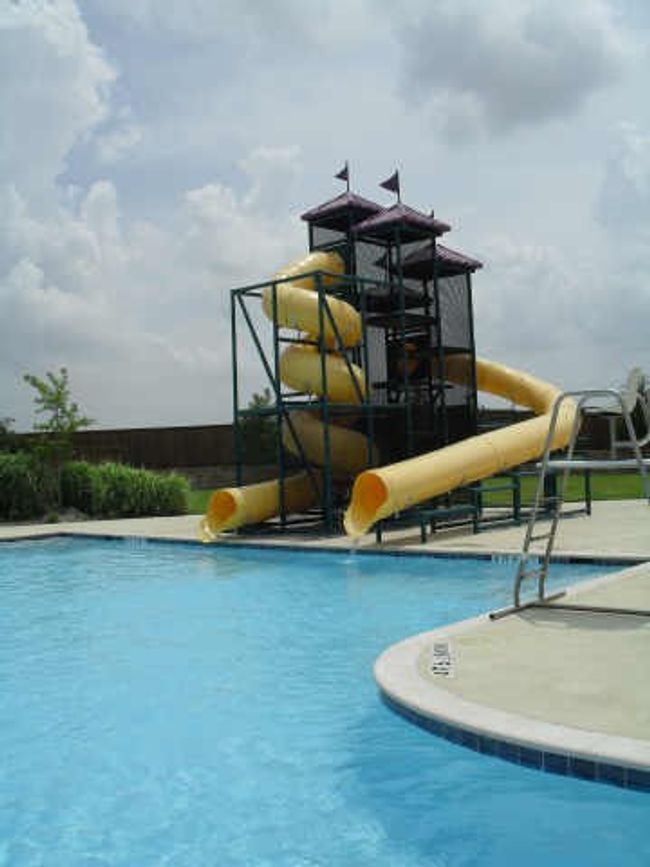 Community pool with a water slide | Image 23