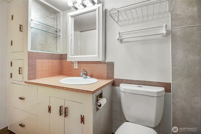 En-suite 3/4 bath off the first bedroom with plenty of storage. | Image 15