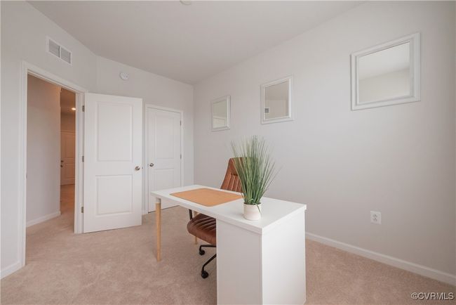 Office space with light colored carpet, baseboards, and visible vents | Image 36