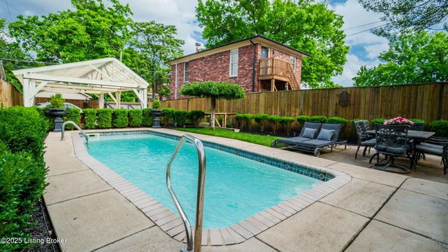 Super rear yard with inground pool and beautiful garderns. | Image 46