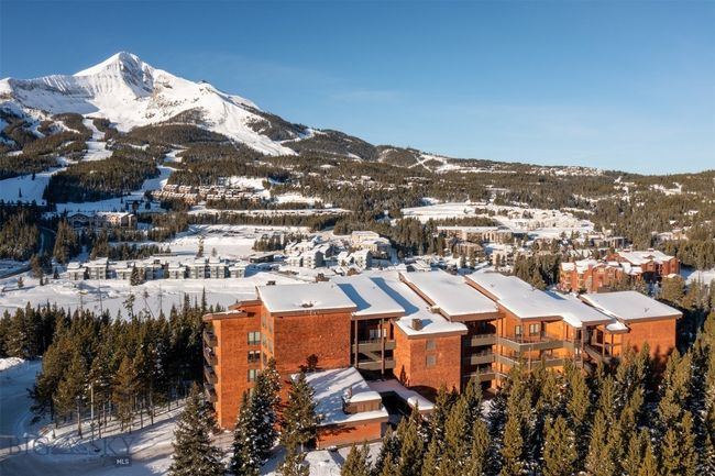 Snowy aerial view featuring a mountain view | Image 25