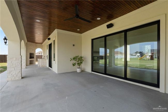 Enjoy seamless indoor-outdoor flow through oversized sliding glass doors, perfect for entertaining. | Image 39