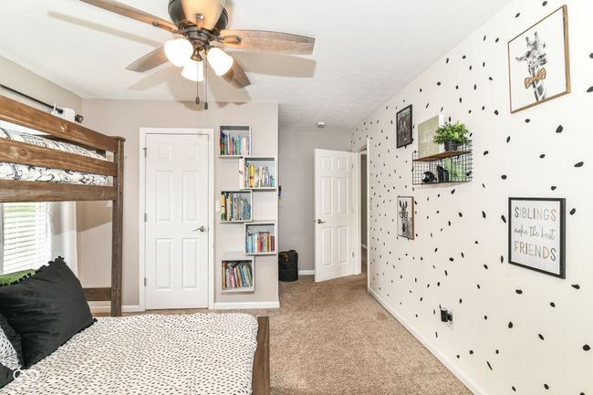 bedroom with carpet, baseboards, and ceiling fan | Image 18
