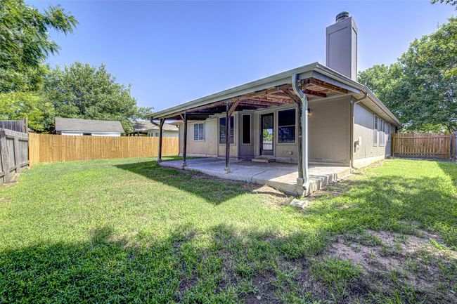 Back of property featuring a patio, a fenced backyard, and a chimney | Image 22