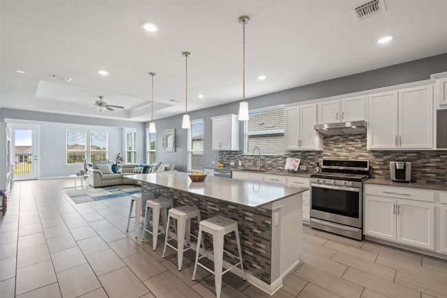 The open concept living and dining in 339 Climbing Rock Loop make it ideal for entertaining. | Image 12