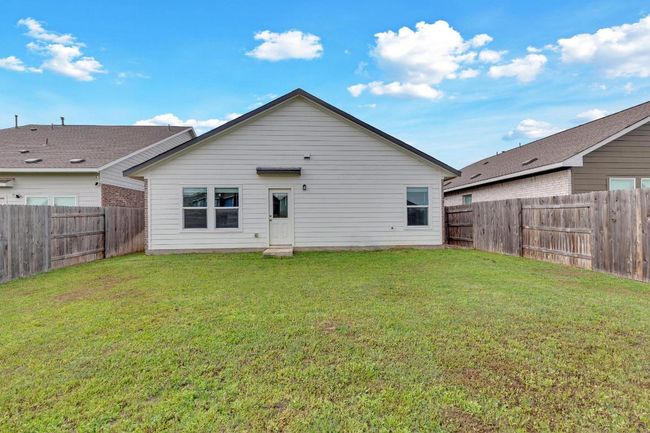Back of property featuring a fenced backyard and a yard | Image 20