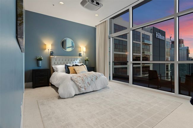 Spacious primary suite with a balcony that you can step into and savor the views while enjoyiing a cup of coffee or a glass of wine. | Image 24