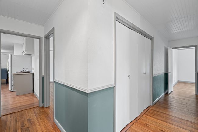 Corridor featuring wood finished floors and baseboards | Image 25