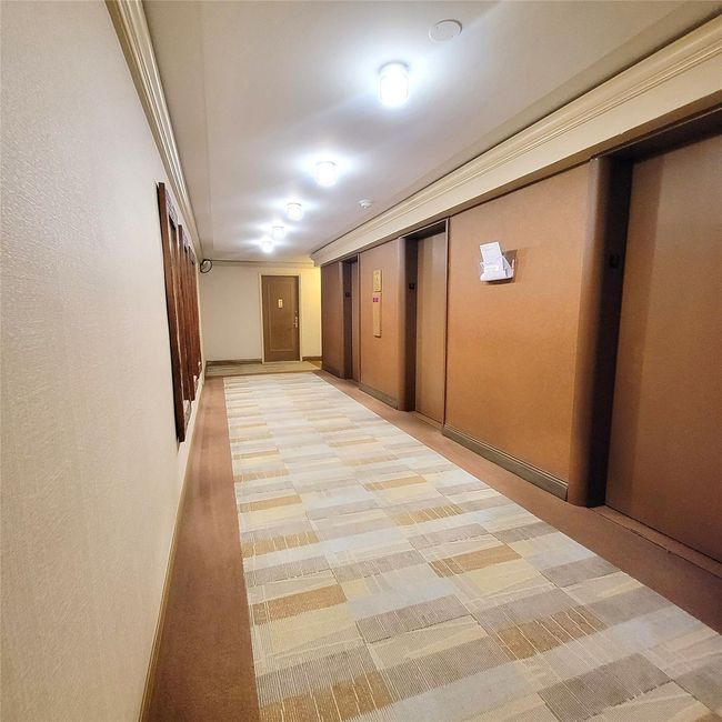 Hallway with elevator and light colored carpet | Image 12