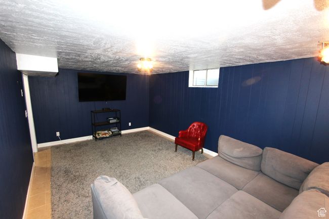 Cinema room with wood walls and baseboards | Image 24