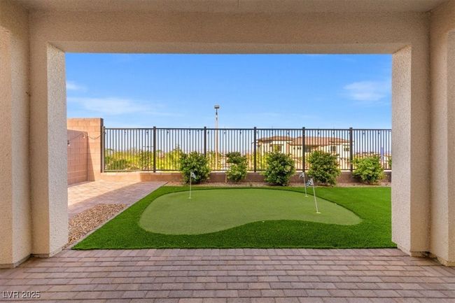 View of yard with fence and a patio area | Image 45