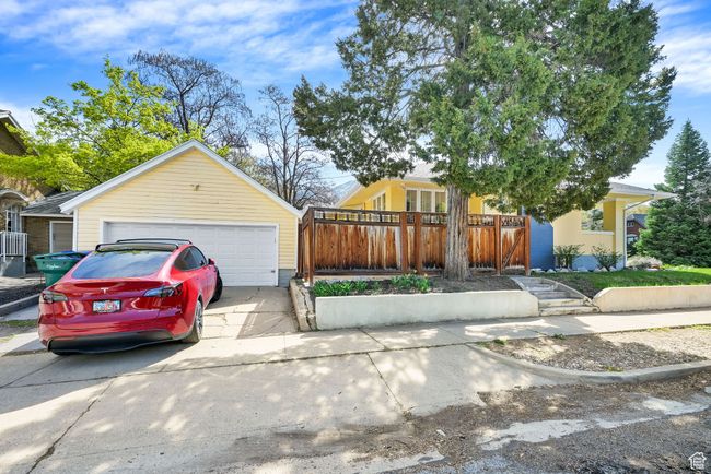 Exterior space with an outdoor structure, fence, and a garage | Image 28
