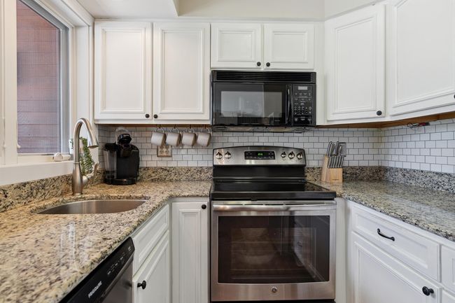 Kitchen is fully equipped and ready for you to move in! Beautiful tile backsplash. | Image 9