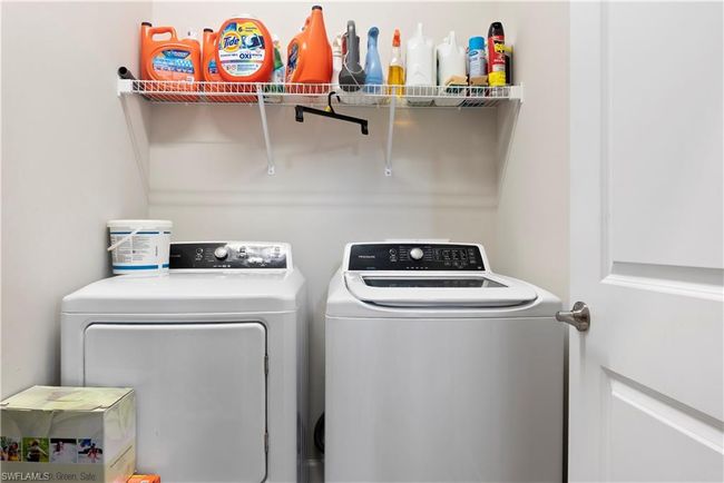 Washroom featuring independent washer and dryer and laundry area | Image 33
