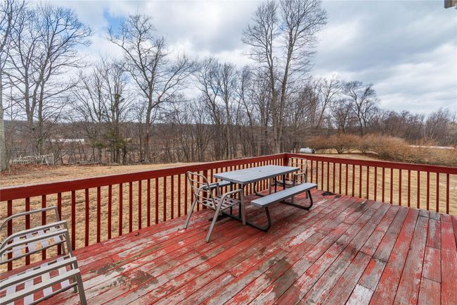 Wooden deck featuring outdoor dining space | Image 6