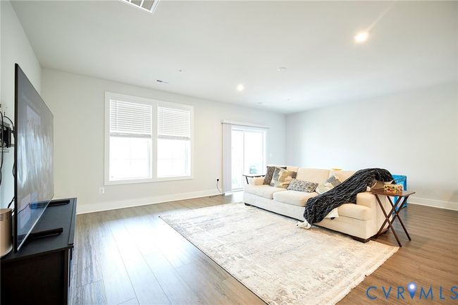 Living room featuring wood finished floors and recessed lighting | Image 34