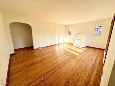 Living room with light hardwood / wood-style floors | Image 3