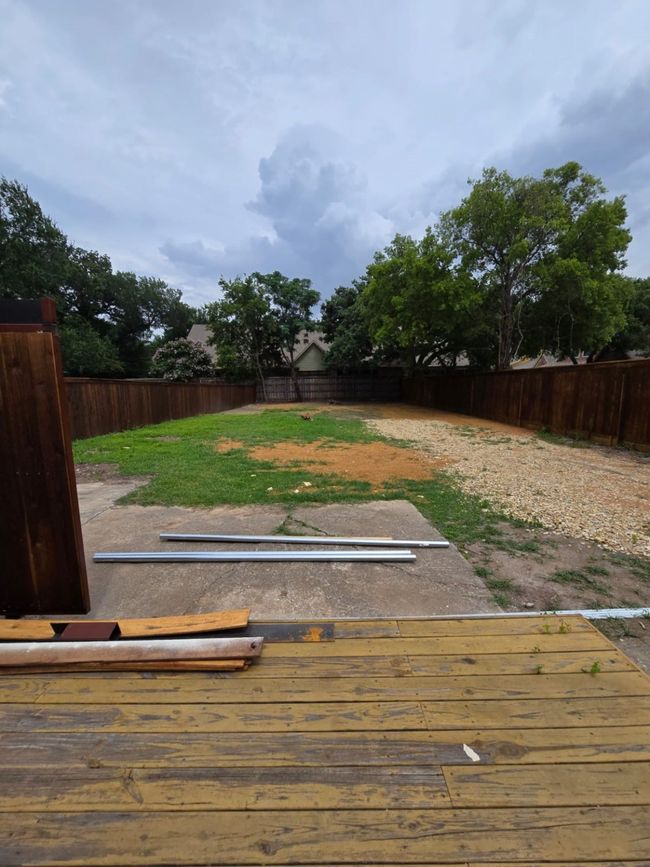 View of fenced backyard | Image 10