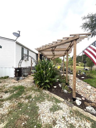 View of yard featuring a pergola | Image 3