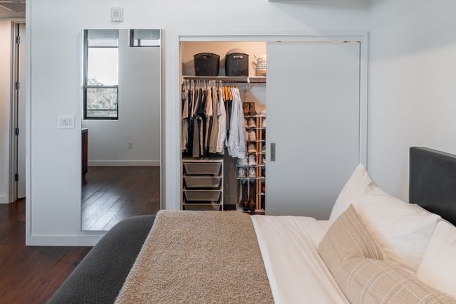 Bedroom featuring baseboards, wood finished floors, and a closet | Image 19