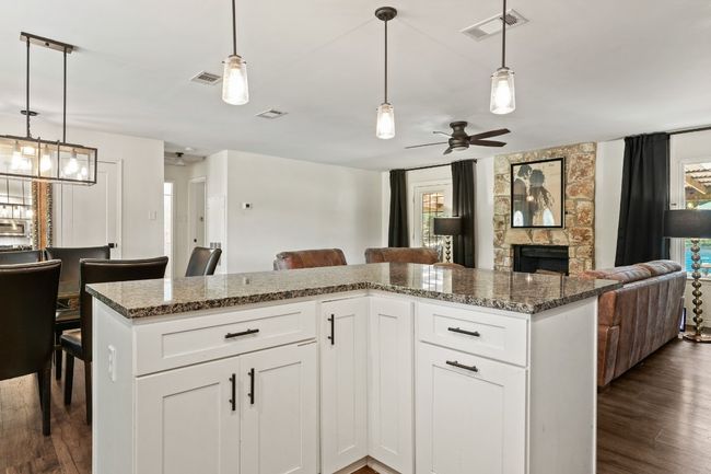 Kitchen opens to the living and dining area. | Image 4