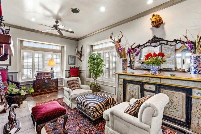 Spacious living area adjacent to the dining room looks onto the bay. Without all of the fine antiques, one can imagine the room layout possibilities. | Image 18
