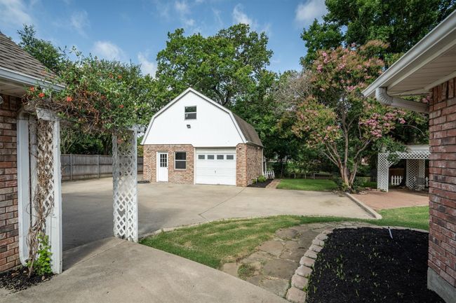 A view from the back patio looking toward the backyard and the detached garage - workshop. | Image 31