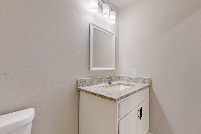 Bathroom featuring vanity and toilet | Image 34