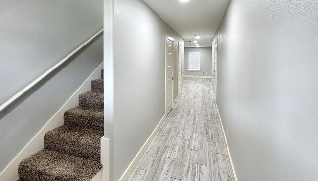 Hallway with light wood finished floors, stairs, and recessed lighting | Image 4
