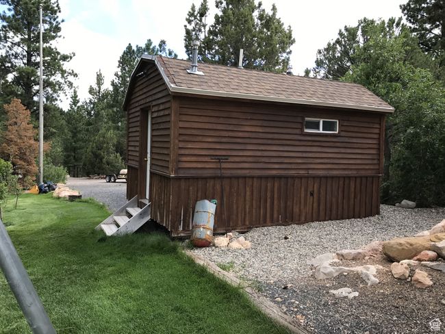 View of side of property with roof with shingles and a lawn | Image 15