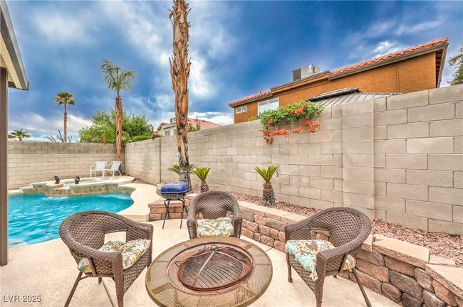 Fenced backyard featuring a fire pit and a patio | Image 36