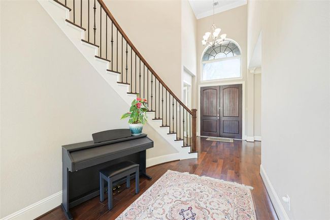 Abundant natural light and an open view into the living room create an inviting first impression. | Image 5