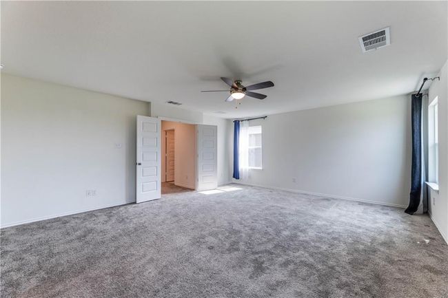 Unfurnished room with a ceiling fan and carpet flooring | Image 21