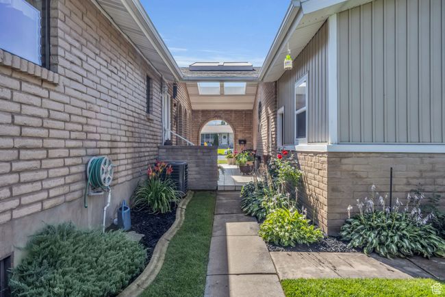 Walkway patio area leading to front door, trophy room, or back yard | Image 43