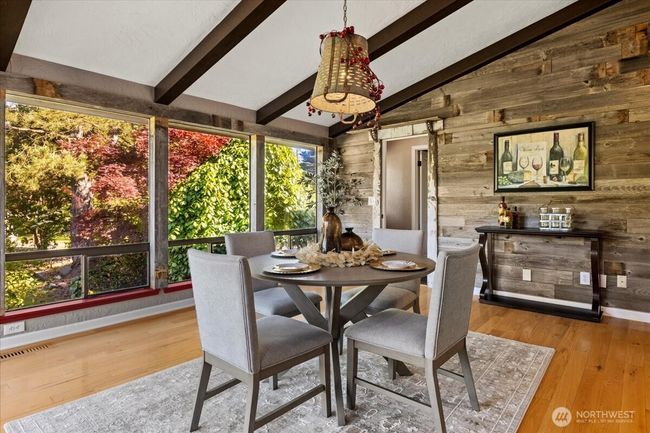 Kitchen eating space with large windows Door to the right leads to junior en-suite. | Image 14