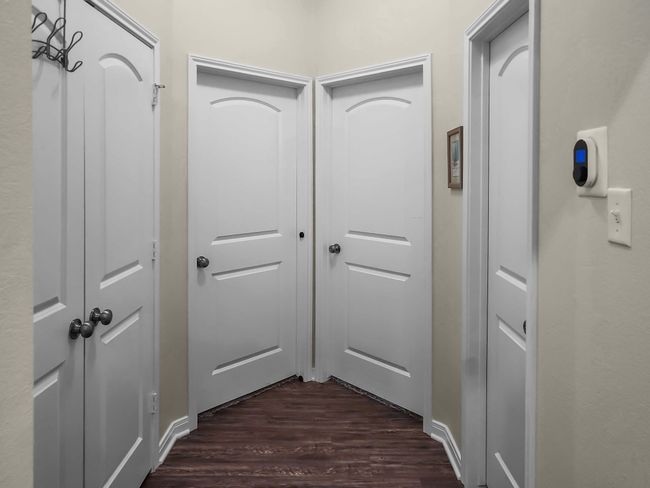 Hall featuring dark wood-style flooring | Image 25