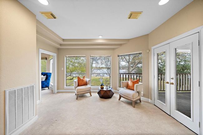 The sitting area provides the perfect nook for enjoying the outdoor scenery, providing a sanctuary for relaxation and appreciation of the estate's natural beauty. | Image 29