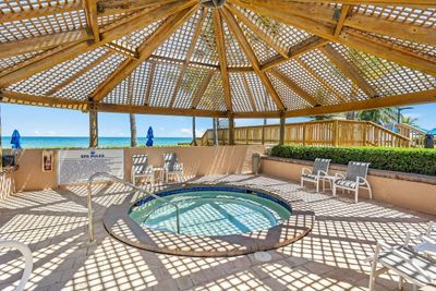 Wooden covered spa located right on the ocean | Image 3