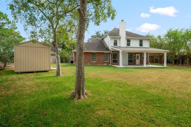 Spacious backyard with tons of green space. | Image 38