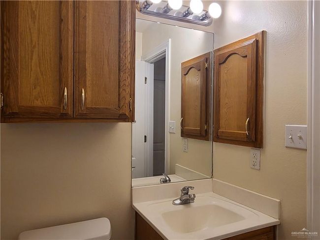 Bathroom with toilet and vanity | Image 7