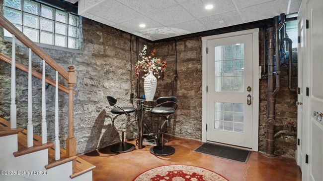 Stairs leading down to the wonderful finished lower level. | Image 36