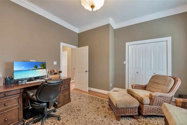 The 2nd secondary bedroom on the 1st level is being used as an office. | Image 29