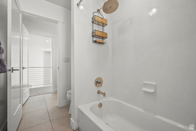 Full bathroom featuring tile patterned flooring and shower / tub combination | Image 22