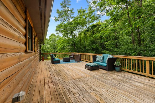 Relax outside on the covered front porch or large back deck | Image 43