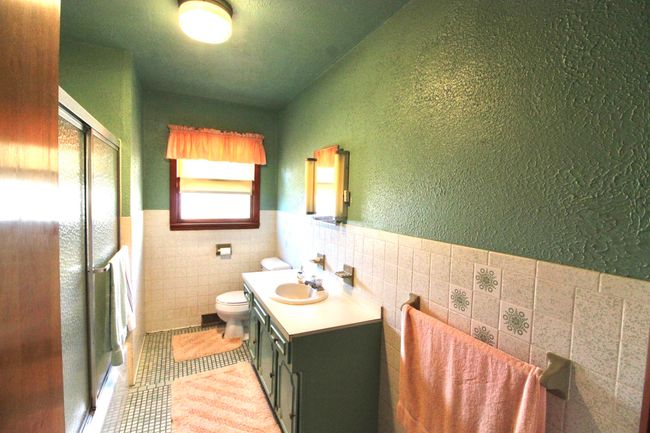 Bathroom with enclosed tub and shower | Image 18