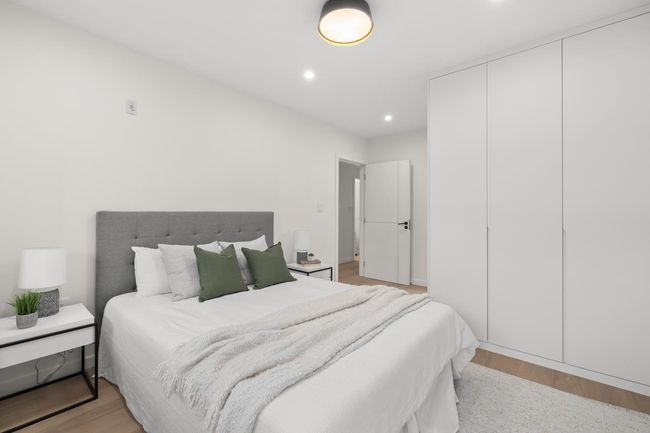 Bedroom featuring a closet, light wood-style floors, and recessed lighting | Image 10