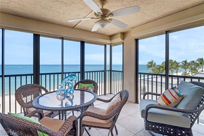 Sunroom featuring a water view and ceiling fan | Image 23