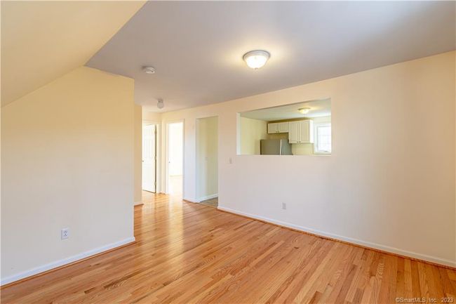Bedroom with opening to kitchen area---the space works well as a bedroom or dining/office area too...plenty of options for the new tenant... | Image 14